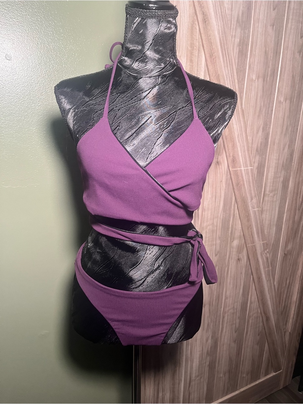 Koral reversible wrap-style two-piece set in purple ribbed + shiny black.